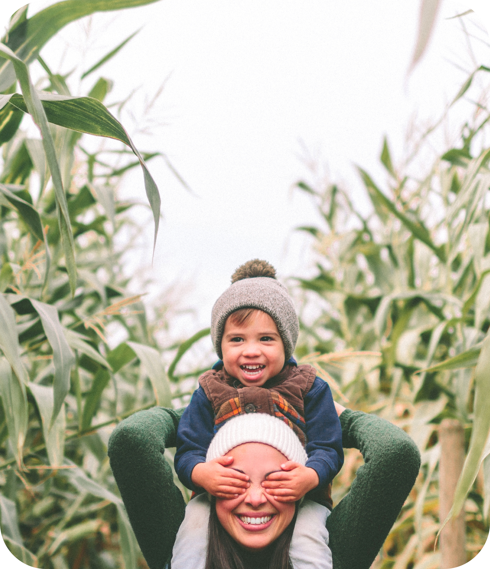 Mom and child in a cornfield
